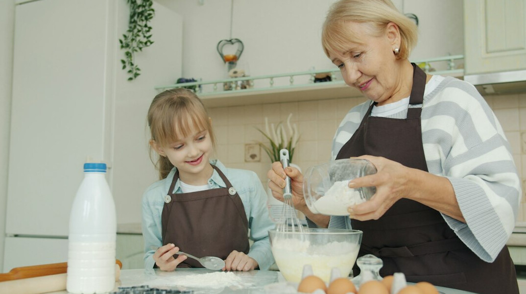 Japanese seniors cooking together in a workshop kitchen