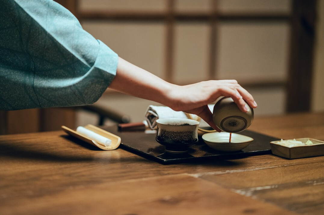 Japanese woman performing a traditional tea ceremony