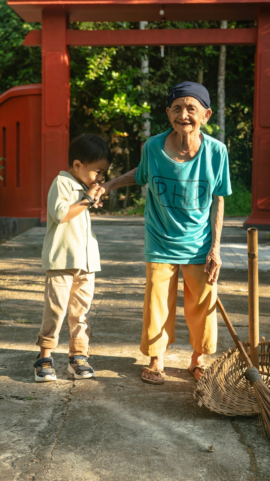 Smiling active Japanese senior citizens standing together outdoors