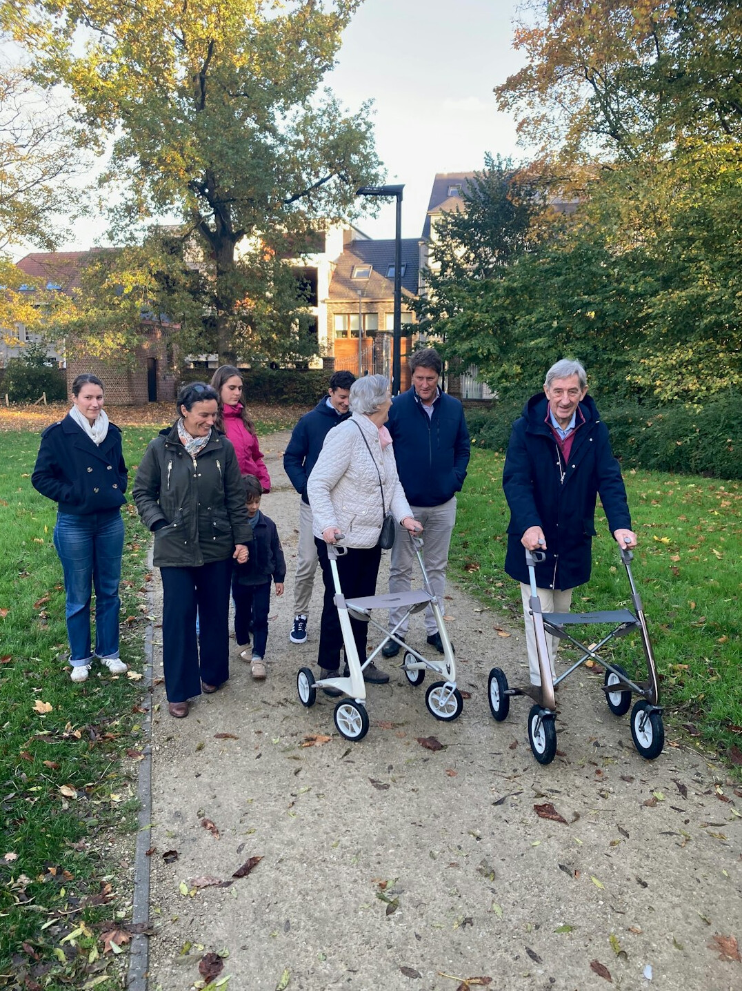 group of seniors walking in park